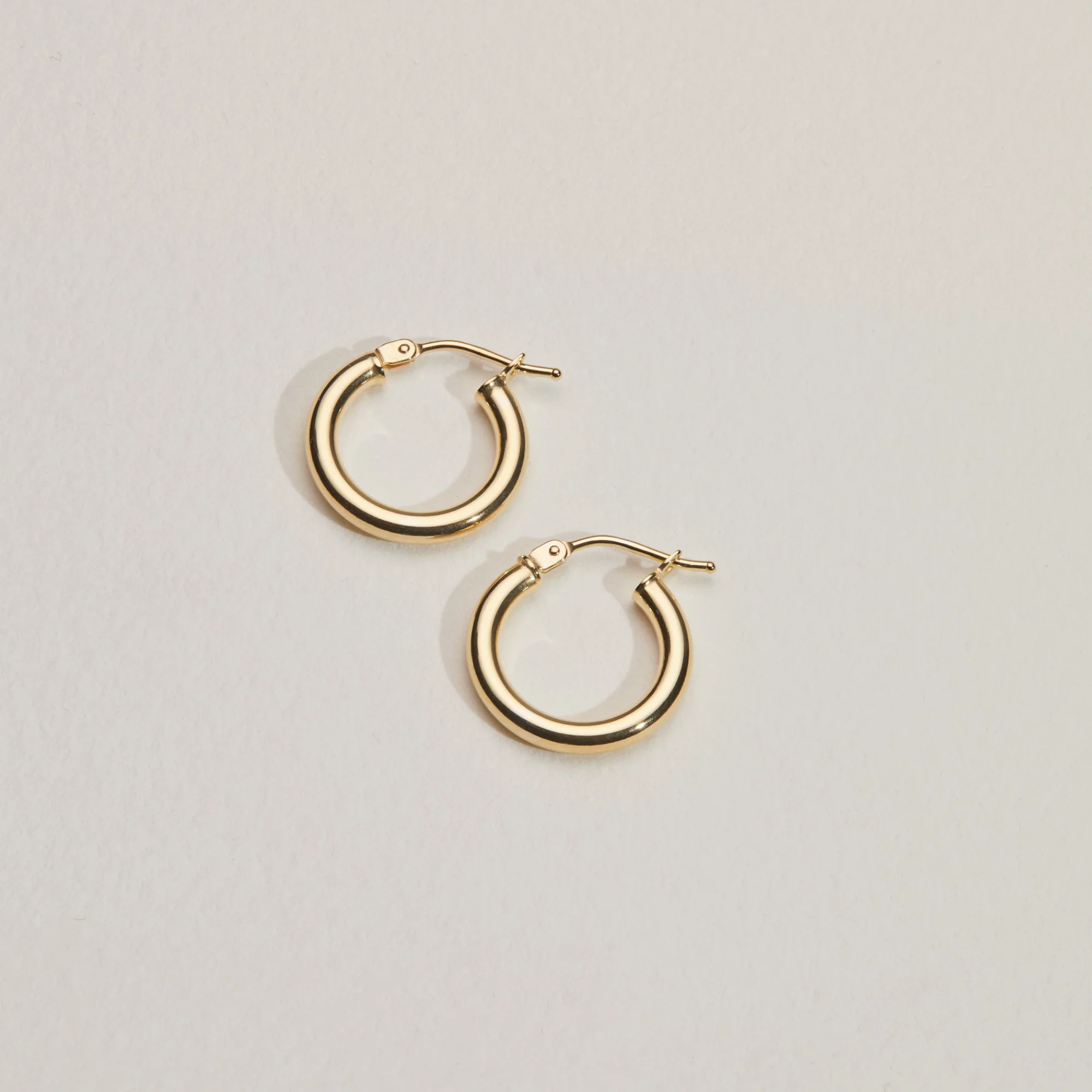 Solid Gold Small Rounded Hoop Earrings - Image 6